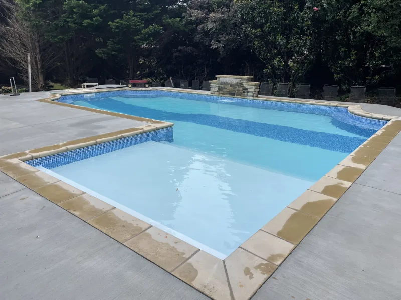 Building plan, eye bolt and screws on plasterboard panels with workers in background